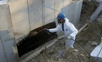 Professional waterproofing the exterior walls of the basement in Hialeah, FL
