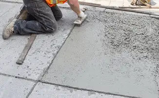 Professional repairing a concrete floor in Hialeah, FL