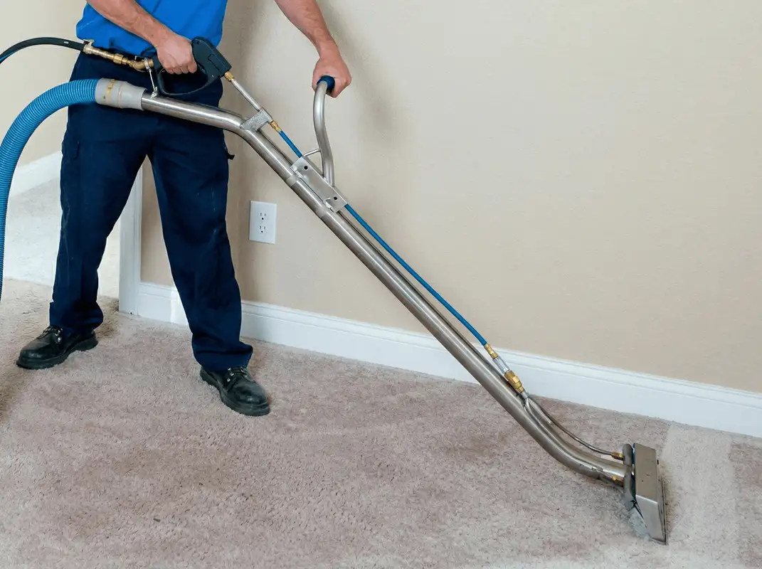 Professional operating a liquid removal machine on a carpeted floor in Hialeah, FL